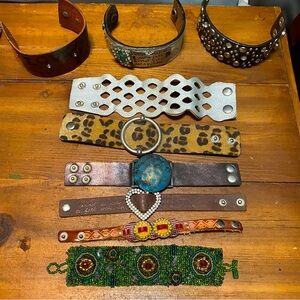 Lot of bracelets, some leather cuff with snaps, see pics for detail